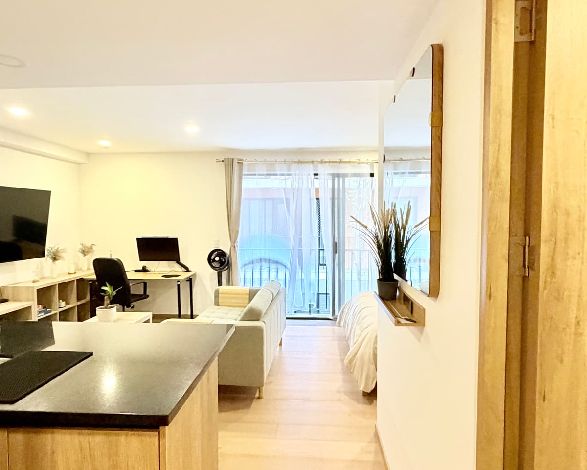 Bright living area with work desk in a StayWork Roma Norte apartment